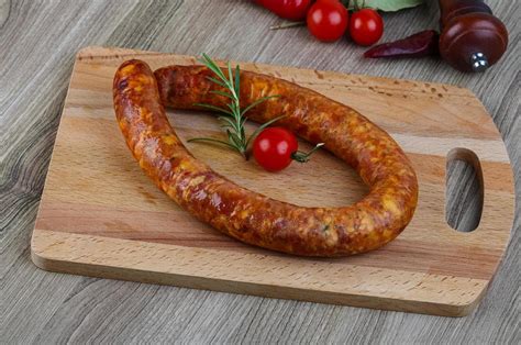 Sausage ring on wood 12771956 Stock Photo at Vecteezy