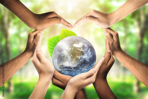 Foto de Conceptual symbol of multiracial human hands surrounding the ...