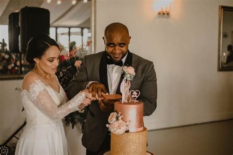 Newlyweds Cutting Wedding Cake · Free Stock Photo