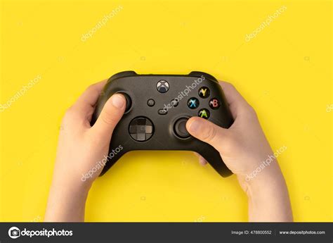 kid holding xbox series controller  jun  sao paulo stock
