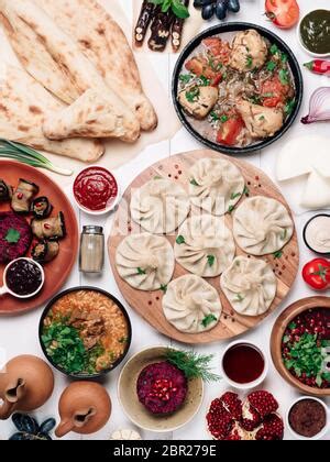 View from above of georgian cuisine on brown wooden table.Traditional ...