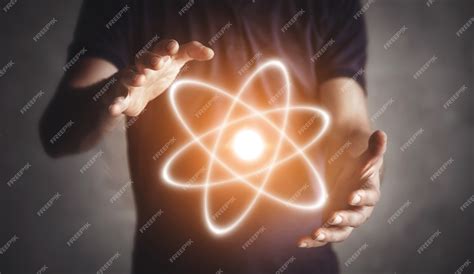 premium photo man holding atom
