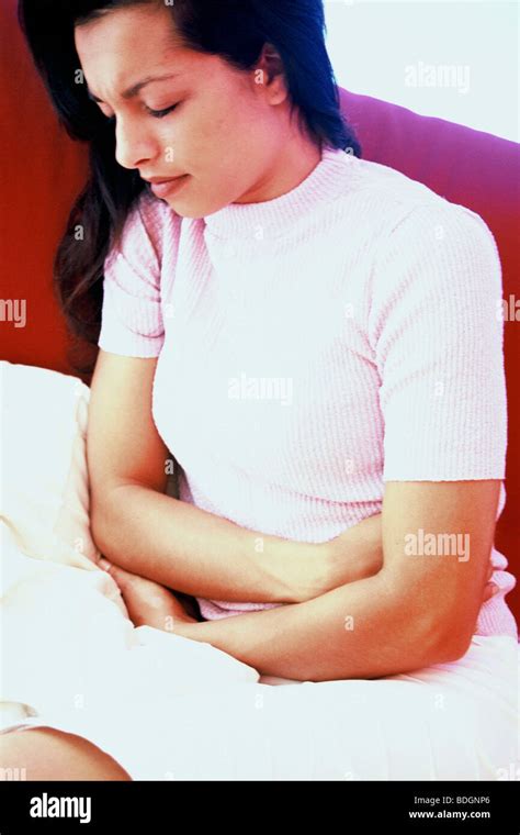 ABDOMINAL PAIN IN A WOMAN Stock Photo - Alamy