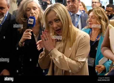 Italian Prime Minister Giorgia Meloni, gestures as she arrives at the ...