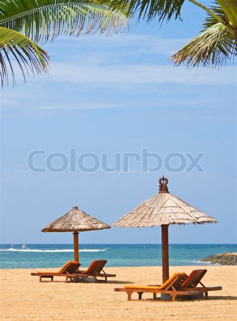 Beach chairs on perfect tropical sandy ... | Stock image | Colourbox
