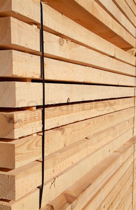 Stack of new wooden studs at the lumber yard | Stock image | Colourbox
