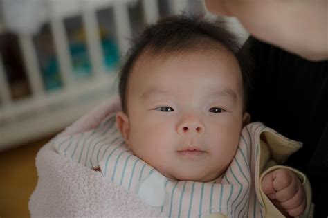 premium photo baby  held