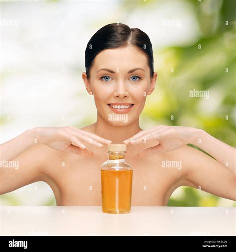 beautiful woman with oil bottle Stock Photo - Alamy