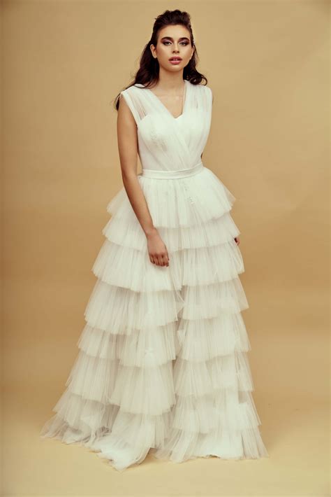 Elegant sheer net layered Wedding Bridal dress with cross detail on the
