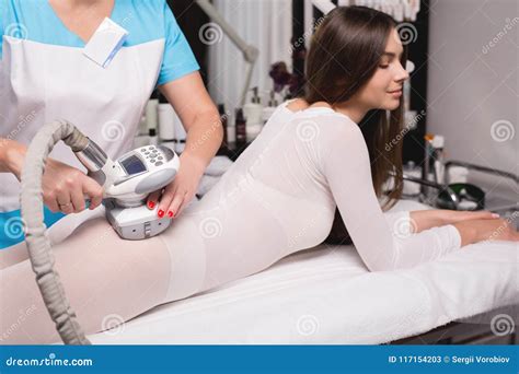 Female Having Procedure of Massage on Legs in Apparatus Cosmetology ...