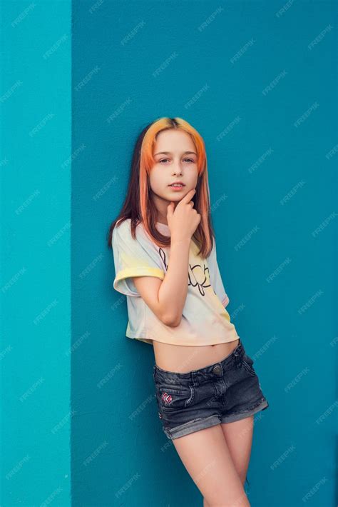 Premium Photo | Girl submissive portrait. a child outside in daylight