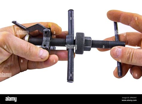 A bearing puller is a tool in the hands of a specialist. Hand working ...