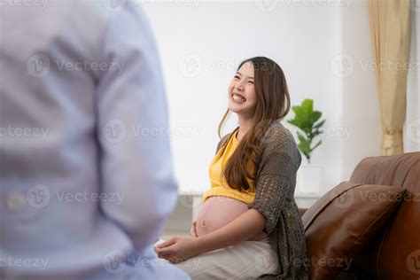 Asian pregnant woman visit gynecologist doctor at medical clinic for