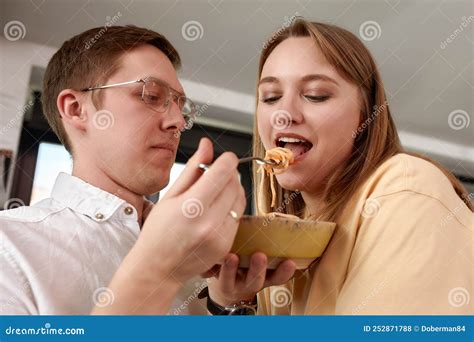 Smiling Loving Husband Feeding Wife, Young Couple Enjoying Tender 