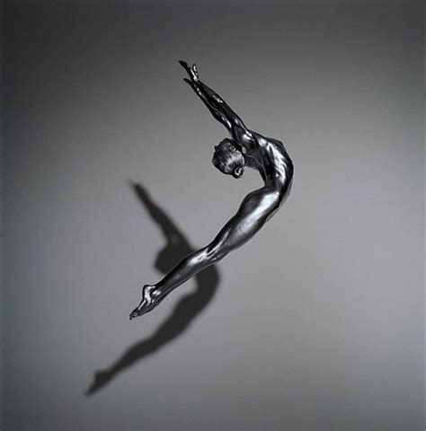 Guido Argentini - Elen - the model in silver, jumping in the air nude