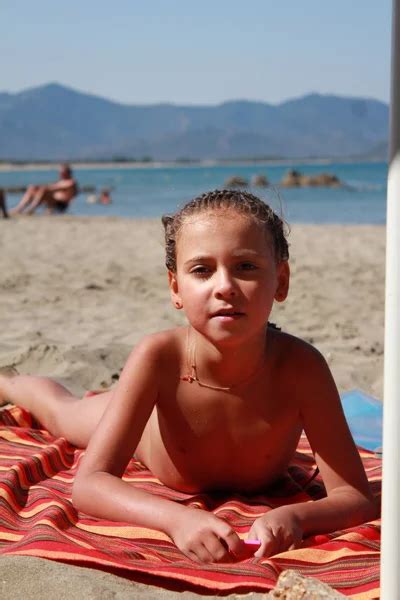 Little cute girl on the beach — Stock Photo © Kama #9887353