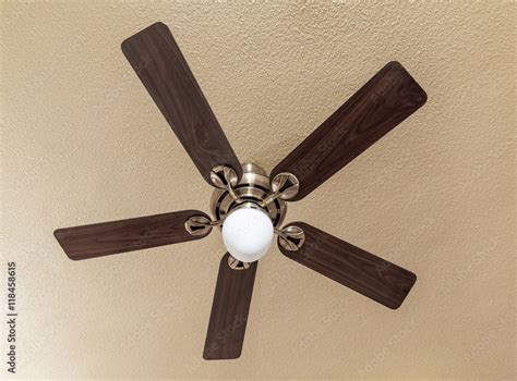 Wooden ceiling fan with light Stock Photo | Adobe Stock