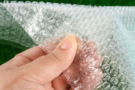 Popping Bubble Wrap Stock Photos, Pictures & Royalty-Free Images - iStock