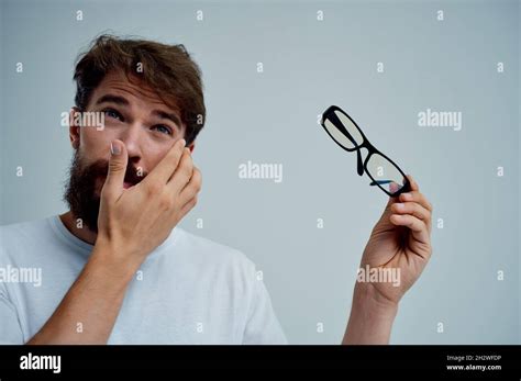 bearded man with poor eyesight health problems isolated background ...