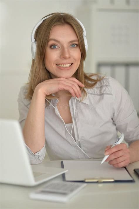 Young Business Woman with Headphones Working in Office Stock Image ...