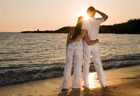 Couple hugging, enjoying summer sunset. — Stock Photo © dimmushka #1988127