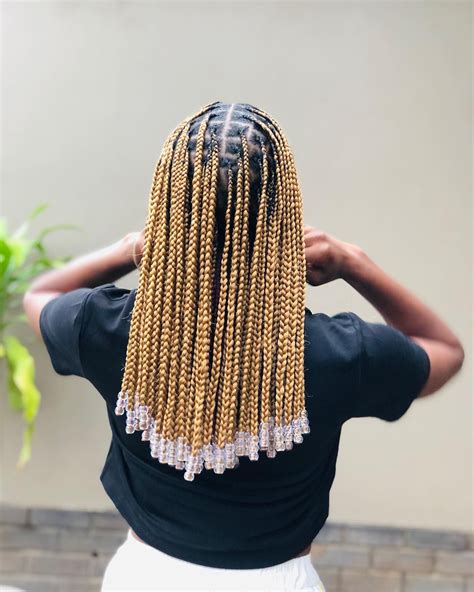 Discover the 31 best box braids with beads hairstyle of 2023 and turn