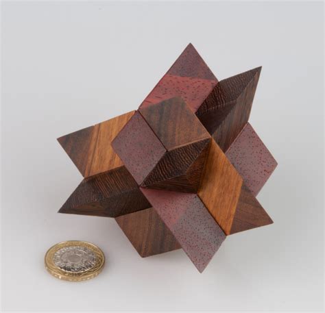 Puzzling Times: Toulouzas’ Triple Rhombic Pyramid