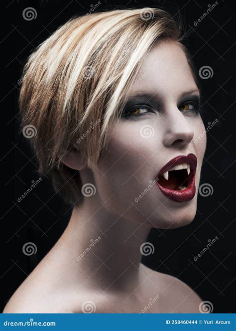 Dont Let Her Seduce You...a Seductive Female Vampire Baring Her Fangs