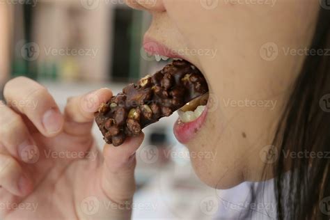 Close-up view of mouth eating food 30819275 Stock Photo at Vecteezy