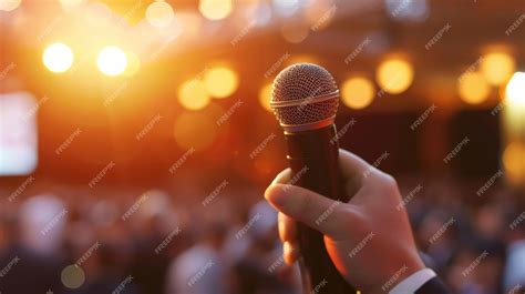 Premium Photo | Hand hold microphone master of ceremony speech to ...