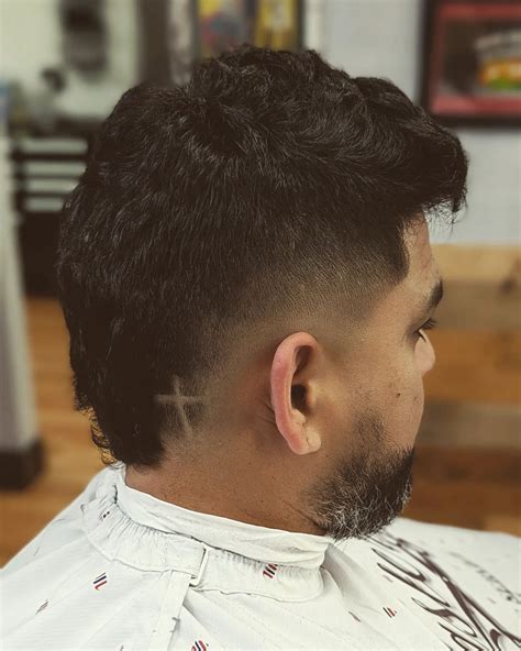 Stylists explain how to maintain a sharp black faded mohawk 15