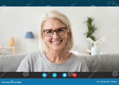 Mature Woman Looking at Webcam Chatting with Relatives by ...