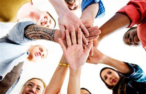 people joining hands  mainrite