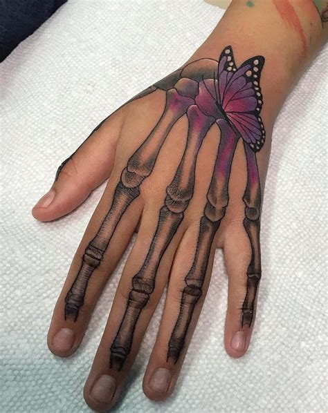 Discover more than 74 skeleton hand holding flowers tattoo latest - in.cdgdbentre