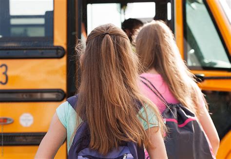 "School Bus: Rear View Of Kids Boarding Bus On Sunny Day" by Stocksy ...