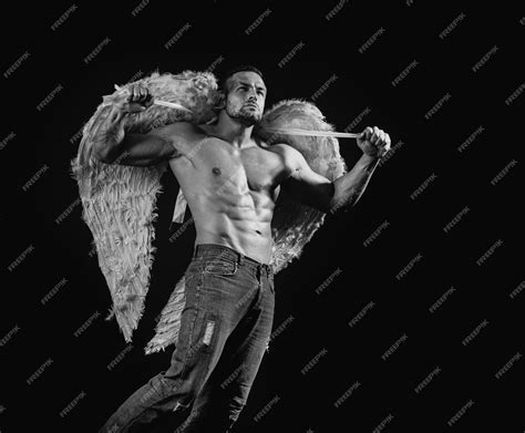 Premium Photo | Wings man angel topless shirtless male model on black