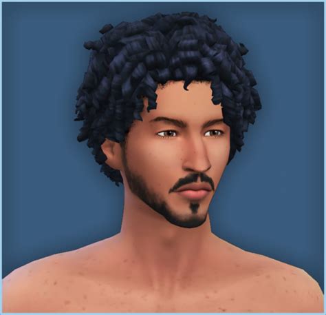 an image of a man with curly hair and beards on his face, looking at ...