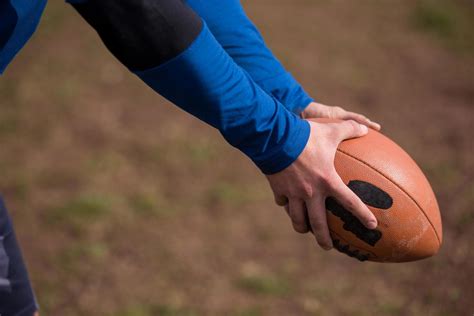 american football kicker practicing kickoff  stock photo