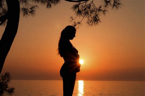 Pregnant woman at sunset - Sussex Travel Clinic