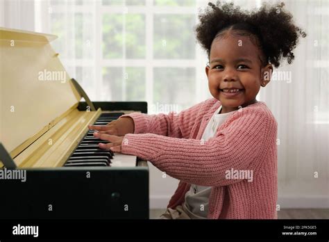 Kid playing piano, Daughter in piano class, Happy kid playing piano ...