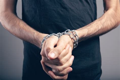 Premium Photo | The man is in chains