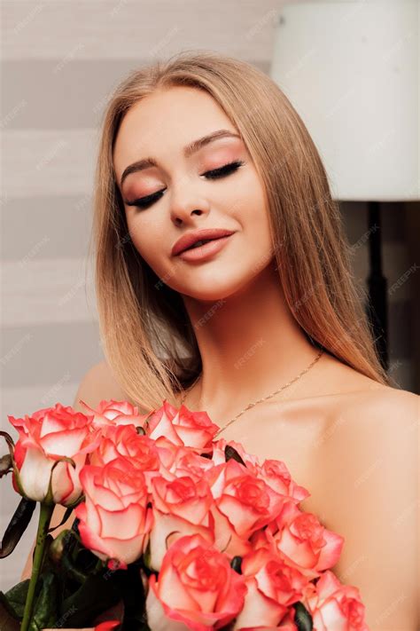 Premium Photo | Young beautiful nude girl with orange roses