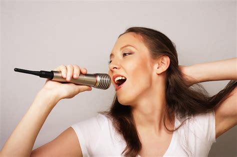 Premium Photo | Happy singing girl. beauty woman wearing white t-shirt ...