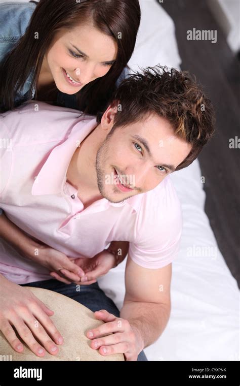 Young couple with a bongo drum at home Stock Photo - Alamy
