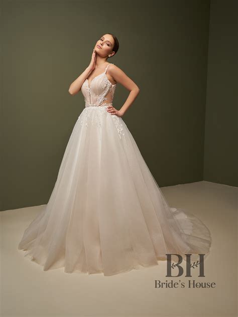 Wedding dress with closed bodice, long transparent sleeves, embroidered