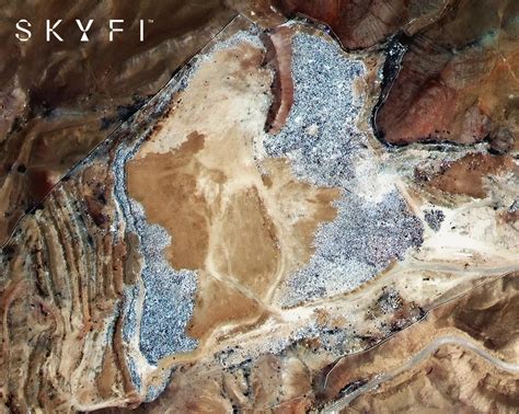 vast pile  discarded clothes  desert   big  visible