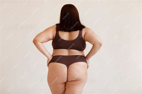 Premium Photo | Medium shot plus size model posing in studio