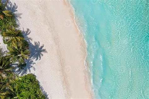 Aerial top view on sand beach. Tropical beach with white sand turquoise