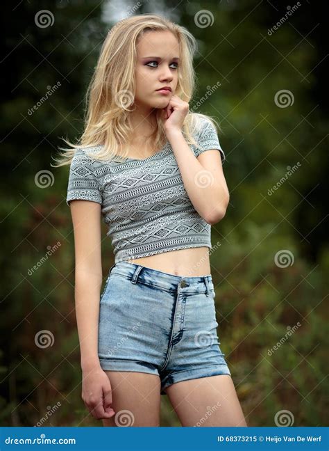 Bautiful Blond Teenage Girl Alone in the Woods Stock Image - Image of