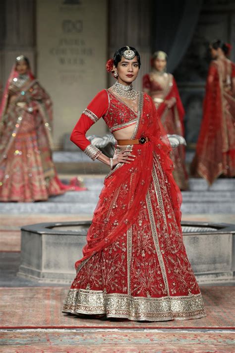 model wearing  red sari  runway  stock photo